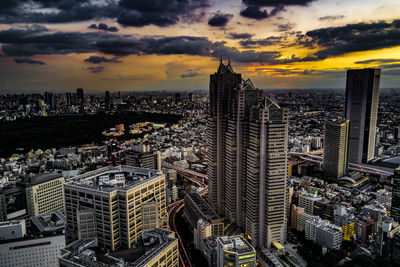 High angle view of buildings in city against sky during sunset