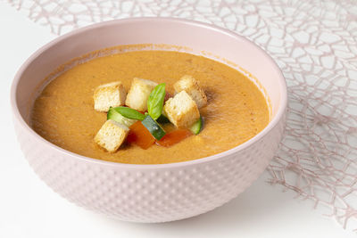 Close-up of soup in bowl on white background