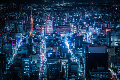 High angle view of illuminated city buildings at night