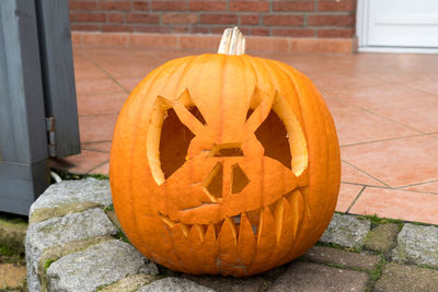 View of pumpkin on stone wall during halloween