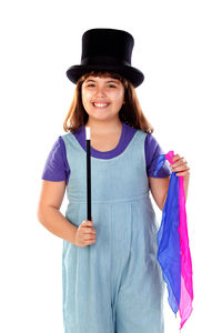 Portrait of smiling girl standing against white background