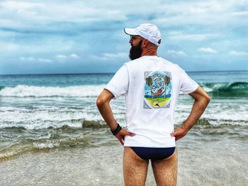 Man near ocean, beach style, bearded man on the beach 