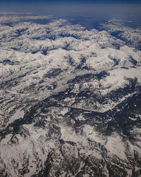 High angle view of snowcapped mountain against sky