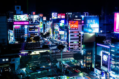 High angle view of illuminated buildings in city at night