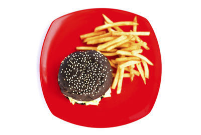 High angle view of burger and fries on plate