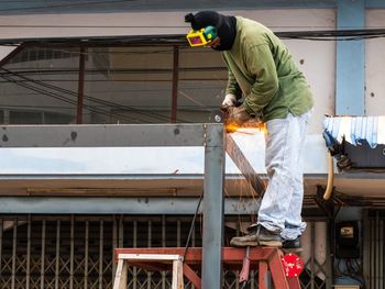 Man working on metal structure
