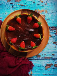 High angle view of strawberries in bowl on table