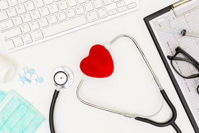 High angle view of heart shape and woman on table