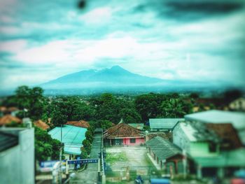 Town against cloudy sky