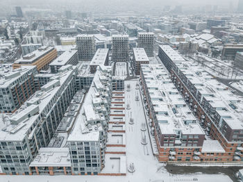 High angle view of buildings in city during winter