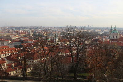 Cityscape against cloudy sky