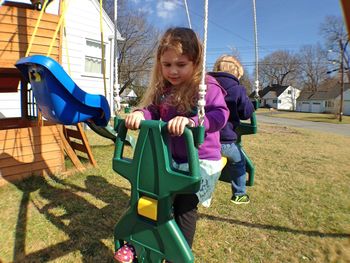 Children swinging at playground