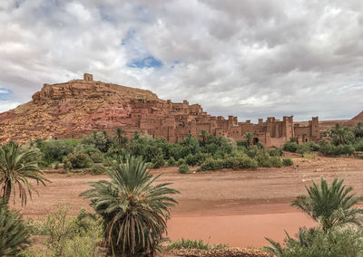 Ancient town in a distance - view of desert against cloudy sky