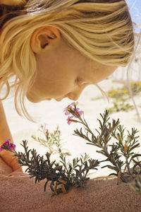 Girl smelling flowers