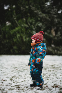 Rear view of woman in hat during winter