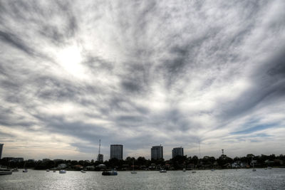 Sea and cityscape against sky