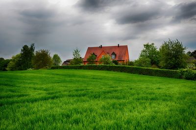 Built structure on field against sky