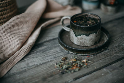 Ceramic mug with tea on a wooden table