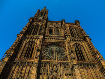 Low angle view of building against blue sky