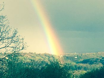 Scenic view of rainbow over mountains