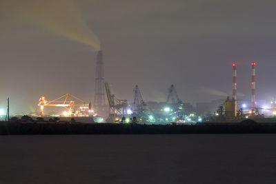 View of illuminated industrial building at night