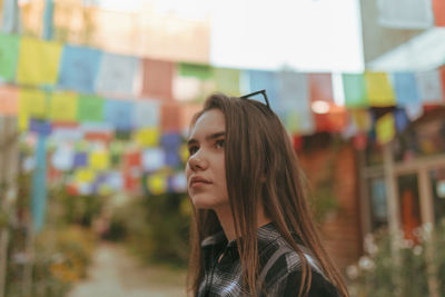 Close-up of young woman looking away