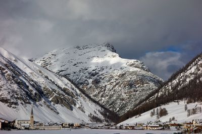 Snow covered mountains against sky