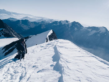 Scenic view of snow covered mountain against sky