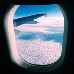 Cropped image of airplane wing