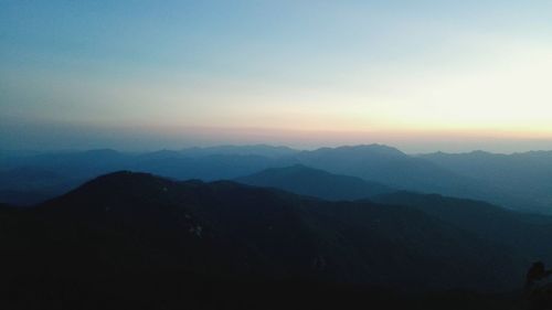 Scenic view of mountains against sky during sunset