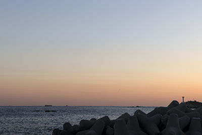 Scenic view of sea against clear sky during sunset