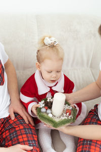 Midsection of woman holding cake