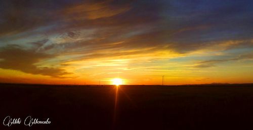 Scenic view of landscape at sunset