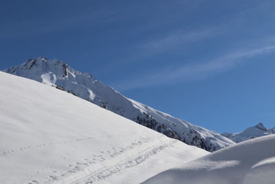 Snow covered mountain against sky