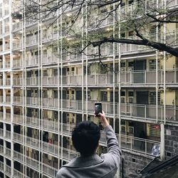 Woman standing in front of building