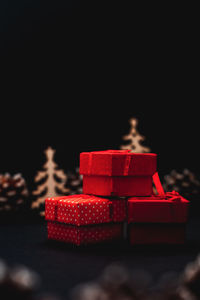 Close-up of toys on table against black background