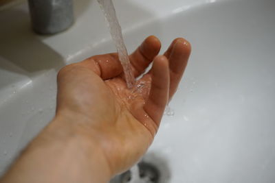 Midsection of man in bathroom