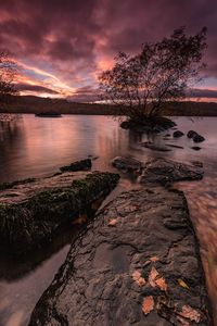 Scenic view of river against cloudy sky 