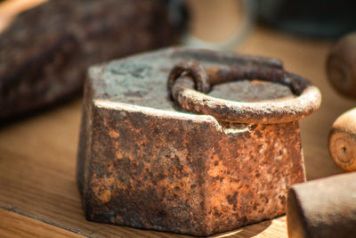 Close-up of rusty metal on table