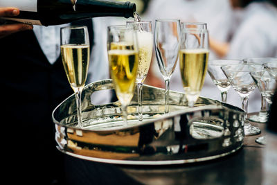 Pouring and serving champagne in a luxury social events like weddings and party.