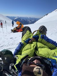 Panoramic view of people on snowcapped mountain