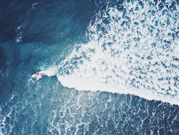 High angle view of man surfing in sea