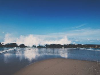 Scenic view of sea against blue sky