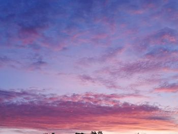 Low angle view of dramatic sky during sunset