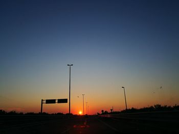 Street against sky during sunset