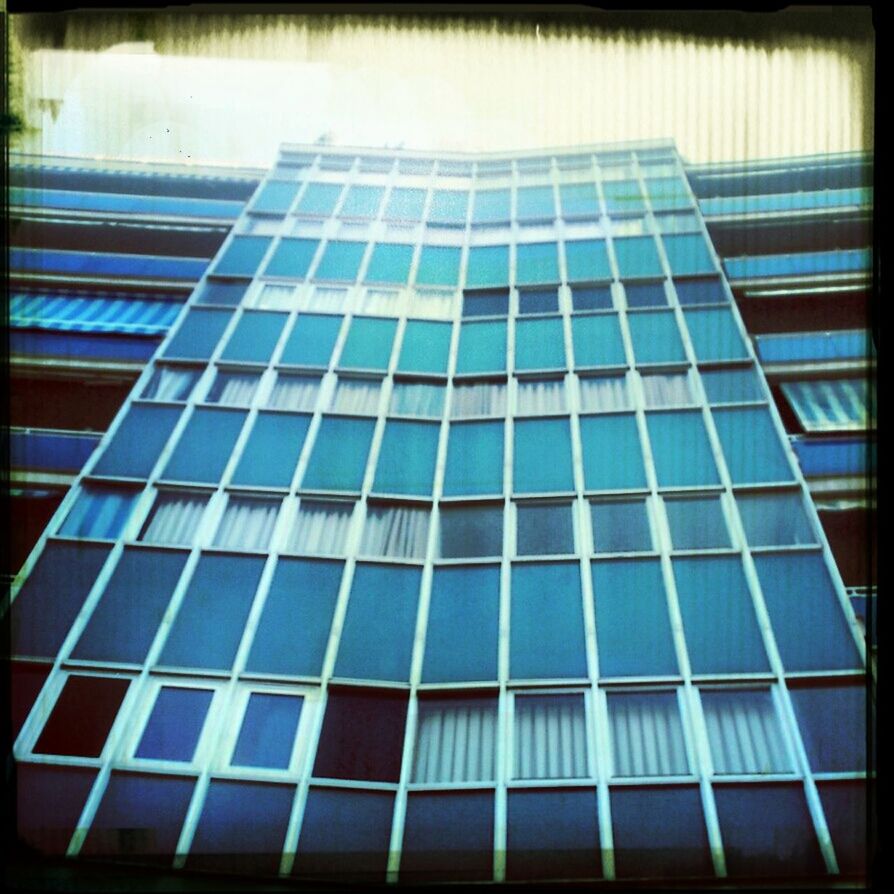 building exterior, architecture, low angle view, built structure, office building, modern, window, glass - material, building, city, transfer print, auto post production filter, reflection, skyscraper, tall - high, full frame, sky, tower, backgrounds, day