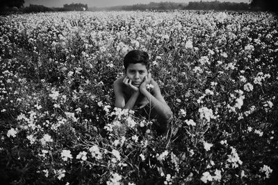 Portrait of smiling young woman on field