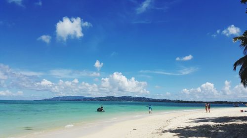 Panoramic view of beach against blue sky