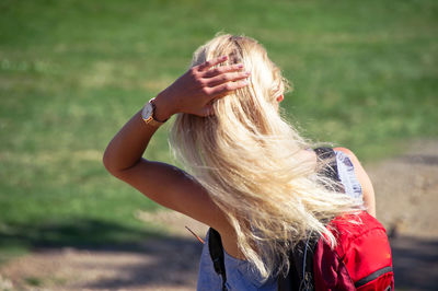 Portrait of woman wearing hat on field