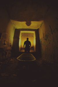 Man sitting on entrance of building